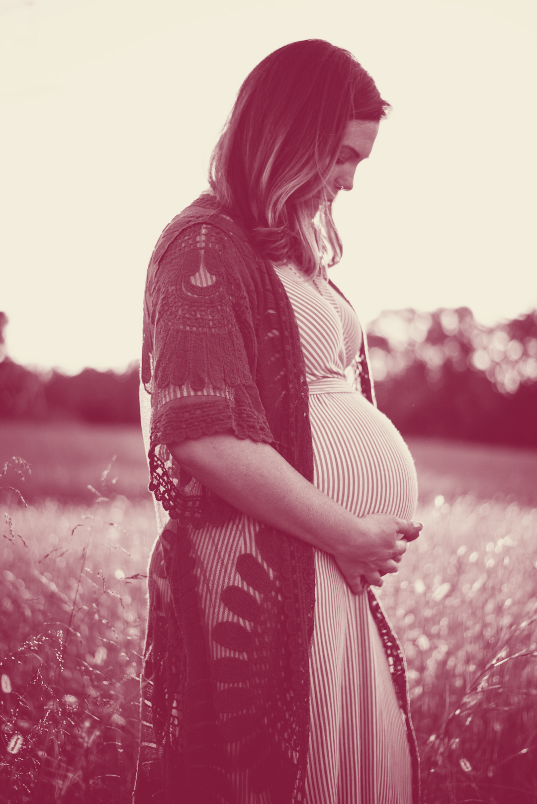 Pregnant woman in a field.